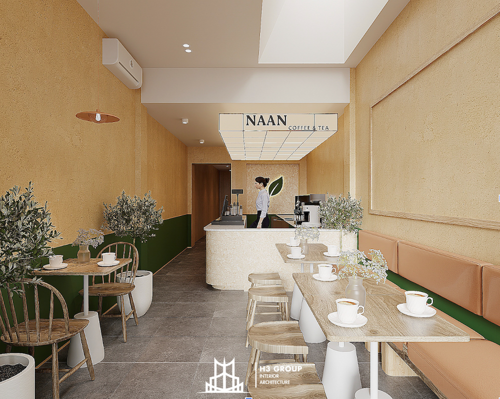 H3 Group thiết kế quán trà sữa Naan phong cách tối giản cực kỳ phù hợp với mặt bằng diện tích nhỏ 15-25m². Quầy pha chế đặt sát tường phía sau, thiết kế theo hình chữ I hoặc L tối ưu diện tích, chỉ cần 2-4 bàn đôi nhỏ, phục vụ 10-15 khách cùng lúc