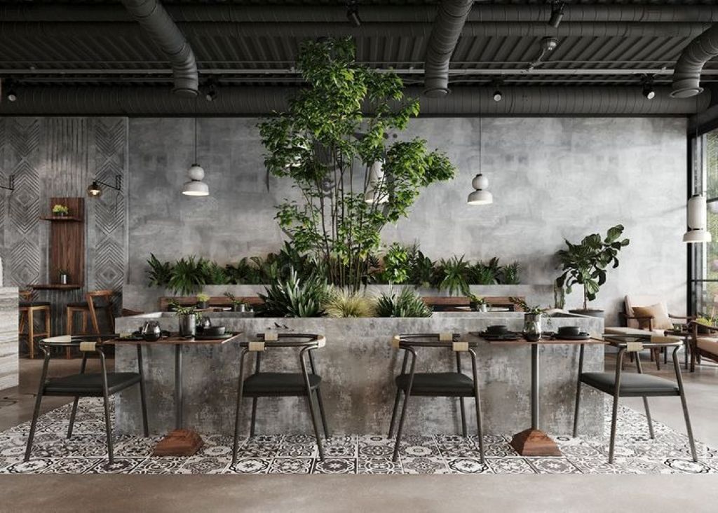 Quán cafe phong cách Industrial điểm xuyết với màu xanh của cây, giúp không gian thêm trong lành, dịu mắt.