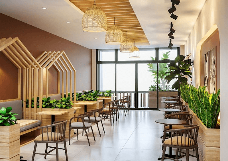 Mẫu thiết kế hiện đại với tông màu nâu ấm áp, nội thất gỗ tự nhiên kết hợp vài chậu cây xanh, tạo không gian thư giãn và gần gũi với thiên nhiên