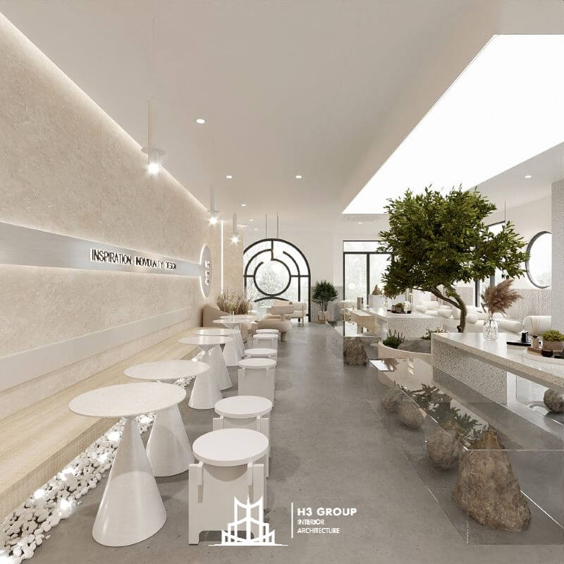 Mẫu quán cafe kết hợp studio nhỏ - sử dụng nội thất cơ bản kết hợp với cây xanh và cửa kính lớn để lấy ánh sáng tự nhiên