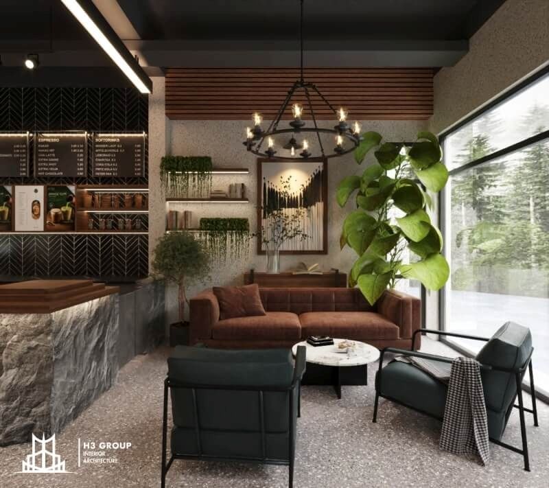 Quán cafe kết hợp phong cách hiện đại với industrial, sử dụng các vật liệu thô như đá, gỗ, điểm thêm sofa và cây xanh, tạo không gian độc đáo, vừa ấm cúng vừa mạnh mẽ