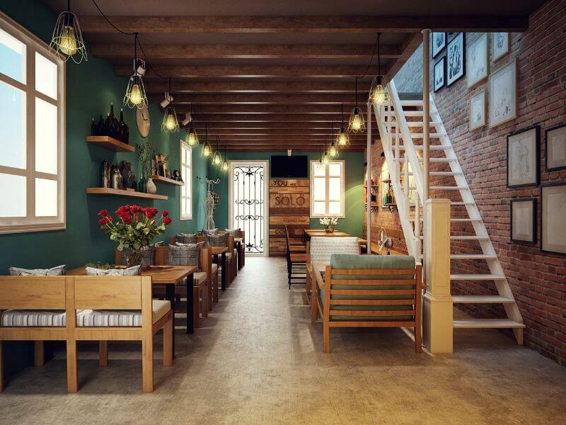 Mẫu quán cafe nhà ống phong cách Vintage có điểm nhấn với nội thất gỗ và màu vàng chủ đạo, tạo không gian ấm cúng