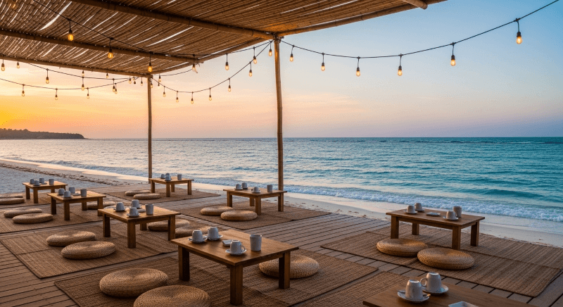 Quán cafe ngồi bệt ngoài biển với không gian mở, tận dụng ánh sáng tự nhiên và gió biển, tạo cảm giác thư giãn, thoải mái và gần gũi với thiên nhiên