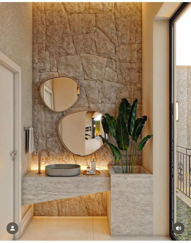 Thiết kế nhà vệ sinh cao cấp với các đường nét kiến trúc độc đáo, sử dụng vật liệu tự nhiên như đá, gỗ, kết hợp với ánh sáng mềm mại, tạo nên không gian tinh tế và đẳng cấp
