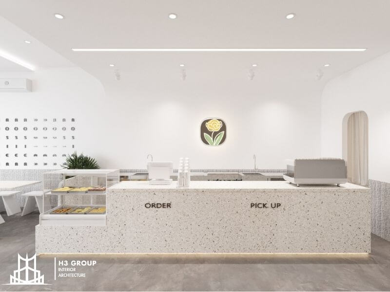 Quầy bar chữ U giúp định hình khu vực pha chế rõ ràng đồng thời tạo điểm nhấn kiến trúc mạnh mẽ