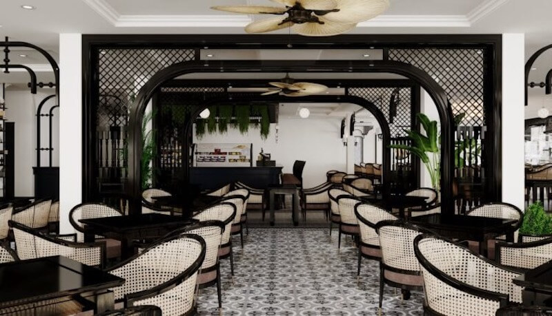 Không gian sang trọng và hoài niệm, nổi bật với nội thất gỗ tối màu, ghế mây tre đan tinh tế cùng họa tiết gạch bông cổ điển, mang đến cảm giác ấm cúng và thanh lịch.