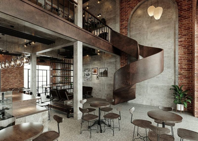Cầu thang xoắn là điểm nhấn kiến trúc tinh tế trong tổng thể quán cafe gác lửng phong cách Industrial 