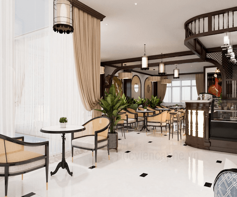Không gian quán cà phê tối giản, tinh tế với nội thất gỗ sáng màu và mảng tường ốp gỗ ấm áp, mang đến cảm giác thanh lịch và gần gũi.