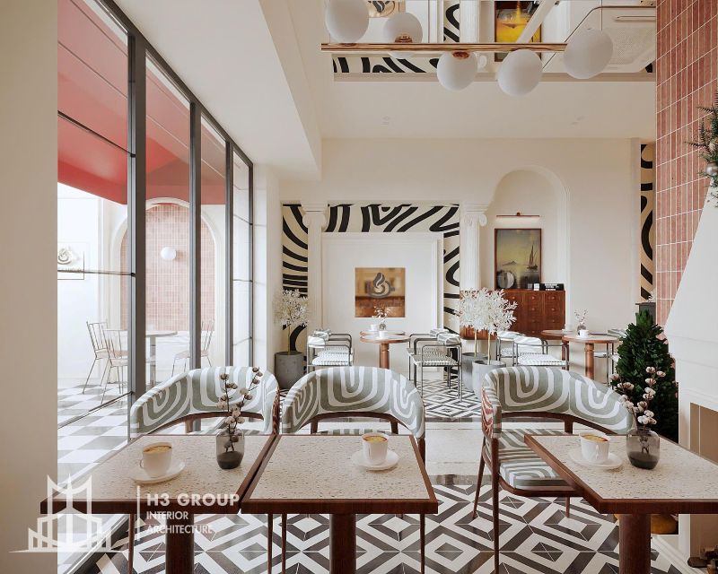 Thiết kế quán cafe trong nhà phong cách nghệ thuật với sự kết hợp họa tiết ấn tượng và tone màu sáng, giúp mang lại trải nghiệm mới lạ cho khách hàng
