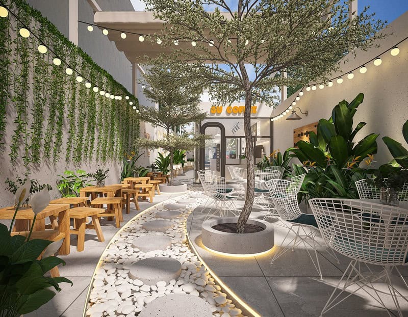 Thiết kế quán nước kiểu sân vườn với không gian xanh mát, đường lát sỏi trắng độc đáo kết hợp điểm xuyết cây xanh và ánh đèn lung linh tạo cảm giác thư thái cho khách hàng