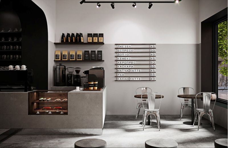 Quán nước sử dụng những món đồ nội thất tối giản, tinh gọn với gam màu đen trắng kết hợp với quầy pha chế làm từ bê tông và ghế kim loại giúp không gian rộng rãi, thông thoáng hơn