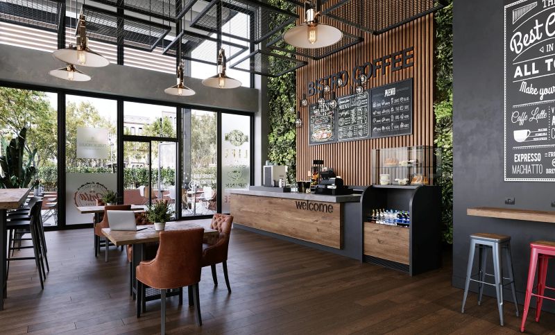 Không gian quán nước pha trộn phong cách hiện đại với công nghiệp, điểm nhấn là tường cây xanh, trần lưới kim loại và vật liệu gỗ ấm áp