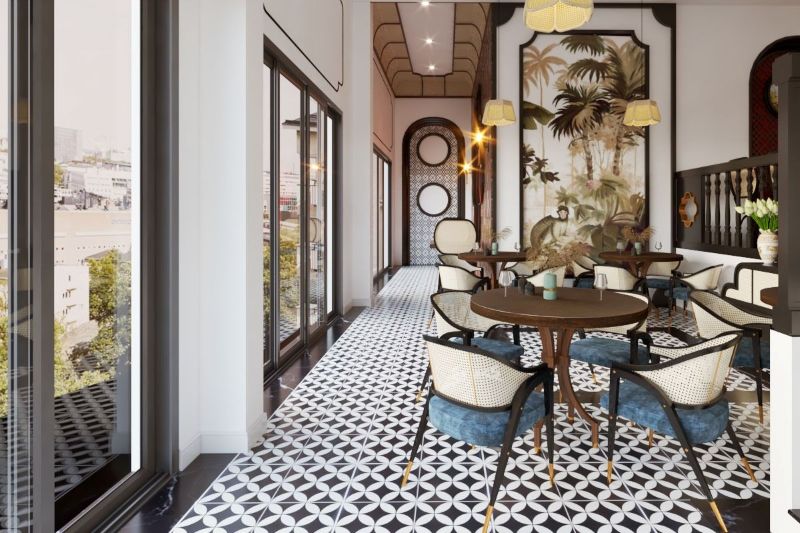 Thiết kế quán cà phê phong cách Indochine sử dụng vật liệu tự nhiên như gỗ, mây tre và gạch bông, mang đến cảm giác ấm cúng, gần gũi 