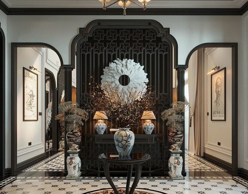 Họa tiết và trang trí Indochine thể hiện qua hoa văn hoa sen, chim hạc, sóng nước và các vật dụng truyền thống như tranh Đông Hồ, bình gốm, đèn lồng 