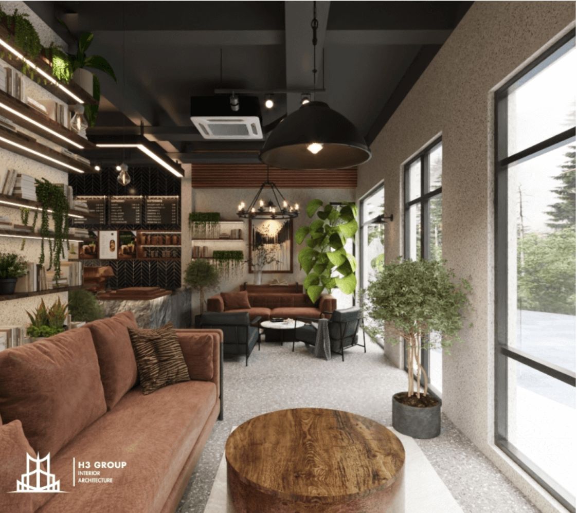 uán cafe phong cách Industrial kết hợp hiện đại, cùng với tường thô, nội thất bọc nỉ ấm áp, cây xanh và giá sách, tạo không gian thư giãn, gần gũi
