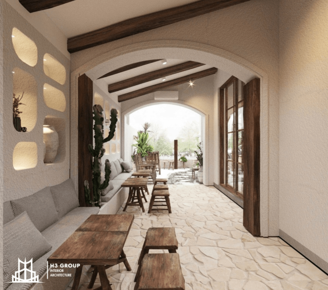 Thiết kế quán cafe theo phong cách Bắc Âu với gỗ mộc, màu trắng be, đường cong mềm mại, nhiều cây xanh và ánh sáng tự nhiên, tạo sự ấm áp và thư thái