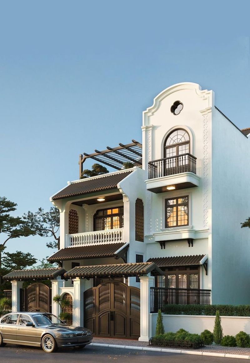 Nhà phố phong cách Indochine mang nét đẹp thanh lịch, kết hợp đường nét hiện đại với chi tiết Á Đông tinh tế như cửa lá sách, lan can sắt và gam màu trung tính