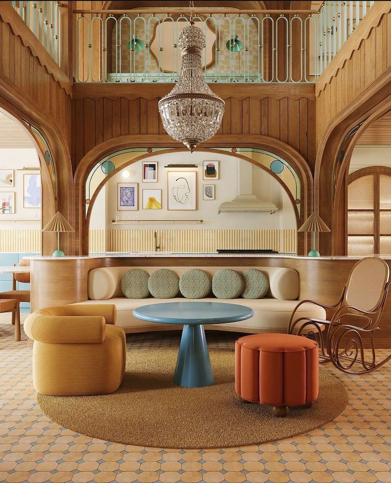 Phong cách Retro trong sảnh khách sạn sử dụng ánh sáng vàng dịu và đèn chùm cổ điển, tạo bầu không khí thư giãn