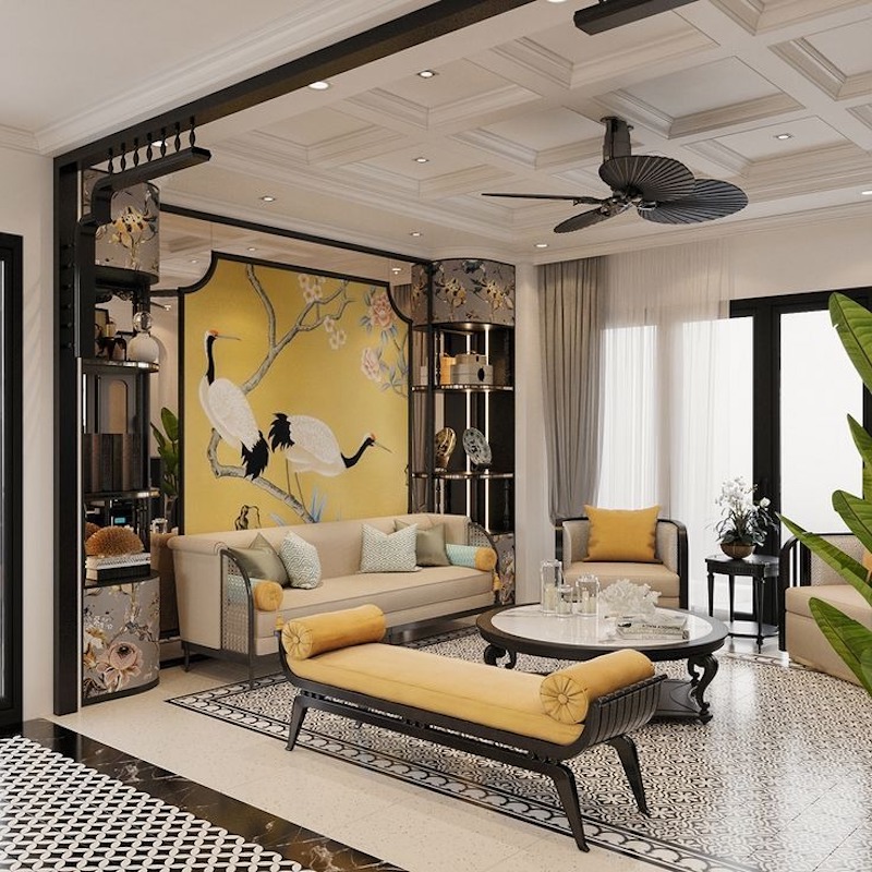 Thiết kế phòng khách Indochine chú trọng trần cao, màu sắc trầm ấm và chi tiết trang trí vừa đủ để không gian tinh tế nhưng không nặng