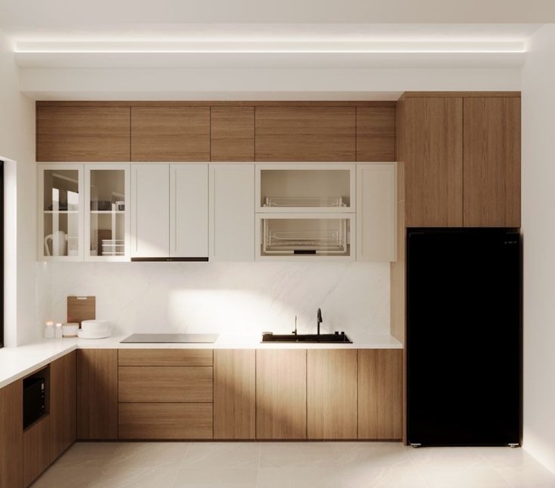 Hệ tủ bếp âm tường phẳng phiu, tối giản chi tiết nhưng vẫn đầy đủ công năng giúp không gian nấu nướng gọn gàng