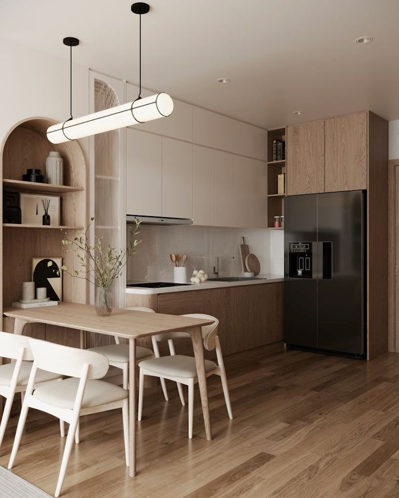 Bàn ăn nhỏ đặt giữa phòng khách và bếp đóng vai trò phân vùng mềm, vừa tiết kiệm diện tích vừa giữ tính thẩm mỹ Bắc Âu tinh tế 