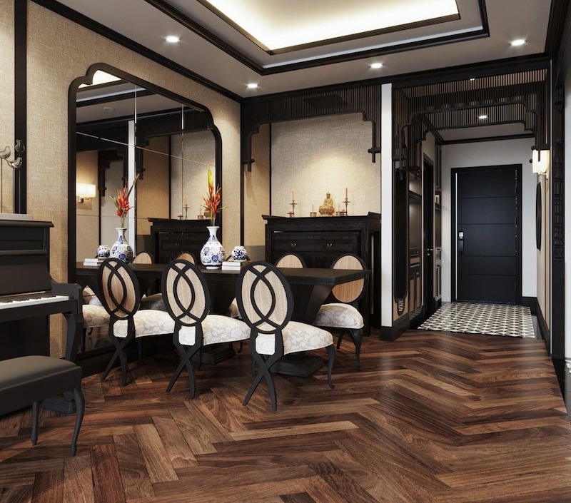 Phòng thờ nhỏ gọn, sử dụng gỗ tối màu, điêu khắc hoa văn Đông Dương tinh tế, kết hợp ánh sáng vàng, mang lại không gian trang nghiêm, tôn kính 