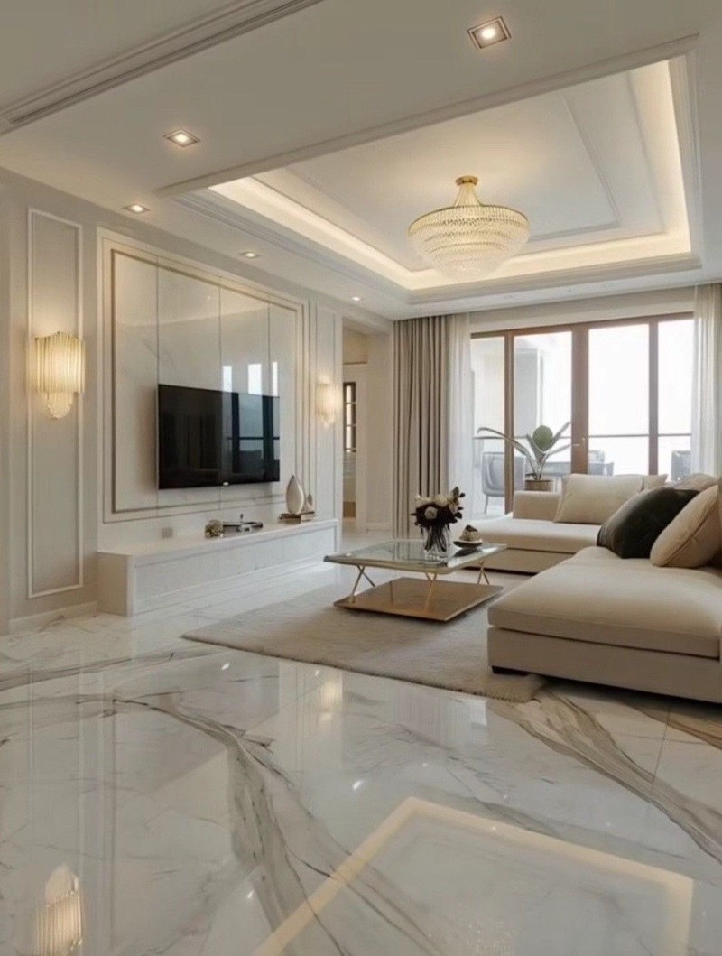 Phòng khách 80m2 nổi bật với sofa cao cấp, bàn trà tinh tế, đèn chùm sang trọng, bố cục liền mạch với bếp, tạo không gian rộng thoáng, ấn tượng 