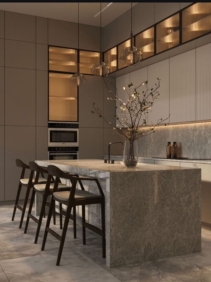 Bàn đảo hoặc quầy bar tích hợp tủ rượu và ánh sáng vàng, vừa tiện dụng vừa nâng tầm thẩm mỹ không gian bếp hiện đại