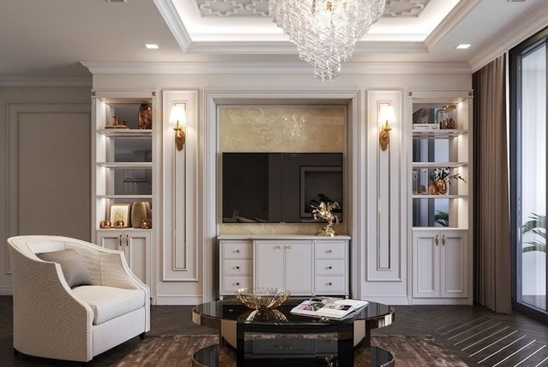 Vách tường ốp phào chỉ và đá Marble phía sau tivi mang vẻ sang trọng, đồng thời nhấn mạnh bố cục cân đối, hài hòa không gian phòng khách 