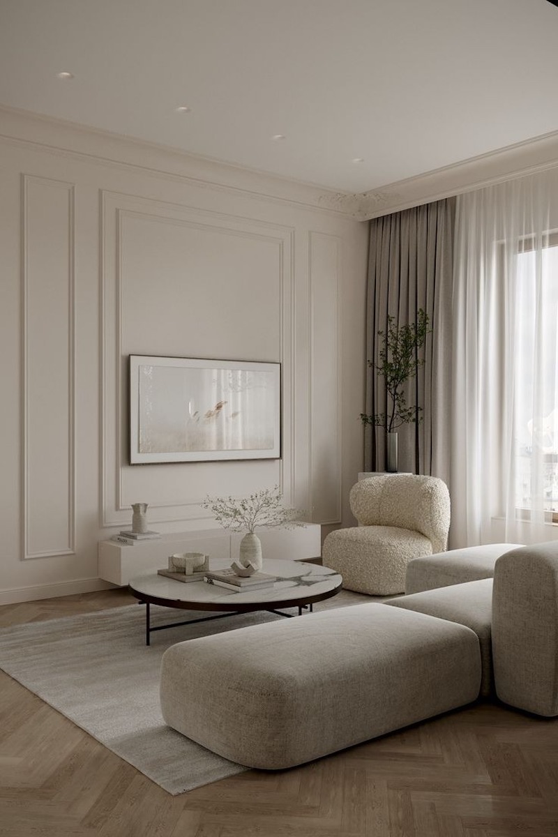 Thảm trải sàn và rèm cửa màu pastel nhạt làm dịu không gian, kết hợp ánh sáng vàng tạo cảm giác ấm áp, thanh lịch cho phòng khách