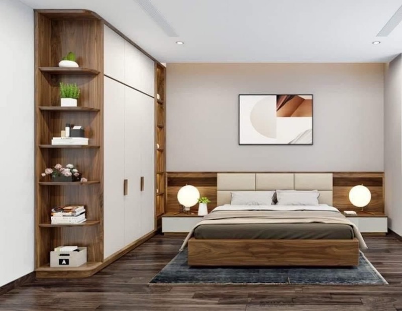 Phòng ngủ hiện đại với hệ tủ gỗ liền kệ và giường đồng bộ, mang đến cảm giác ấm áp và gọn gàng