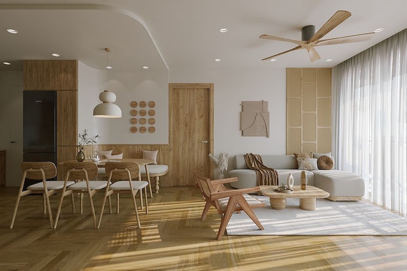 Sử dụng hệ nội thất chân thấp kết hợp cùng các đường bo tròn mềm mại của bàn trà và ghế thư giãn giúp 'hack' chiều cao trần, tạo cảm giác không gian thoáng đãng hơn đáng kể