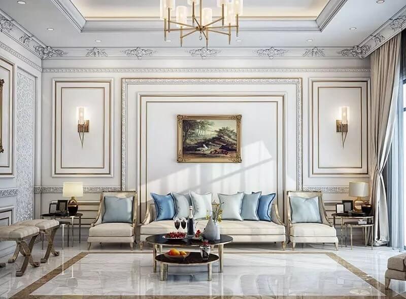 Phòng khách sang trọng với tông màu nhẹ nhàng, nội thất có đường cong tinh tế và các chi tiết trang trí trên tường