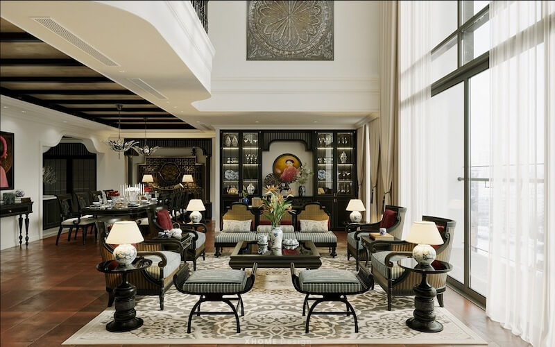 Không gian mở nối liền phòng khách và phòng ăn phong cách Đông Dương sang trọng với sofa gỗ chạm khắc, họa tiết kỷ hà trên thảm