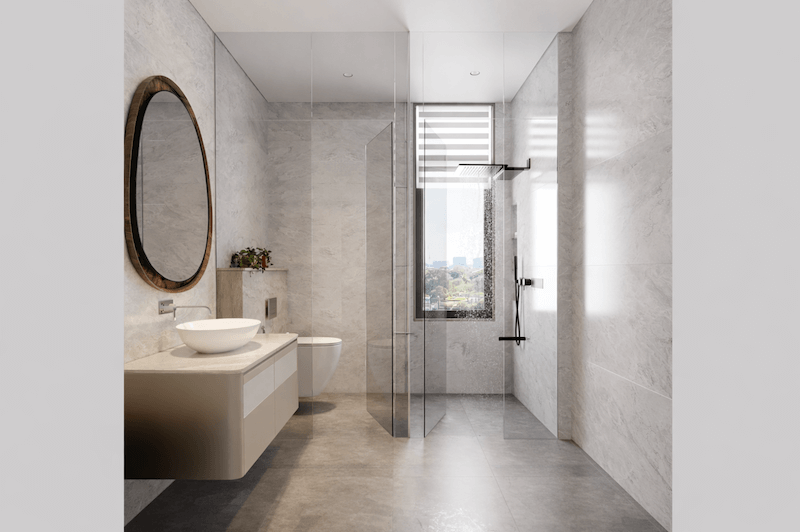 Phòng tắm với gam đá trung tính, bố trí khô - ướt tách biệt bằng vách kính, kết hợp cửa sổ lớn giúp không gian luôn thoáng sáng và sạch sẽ