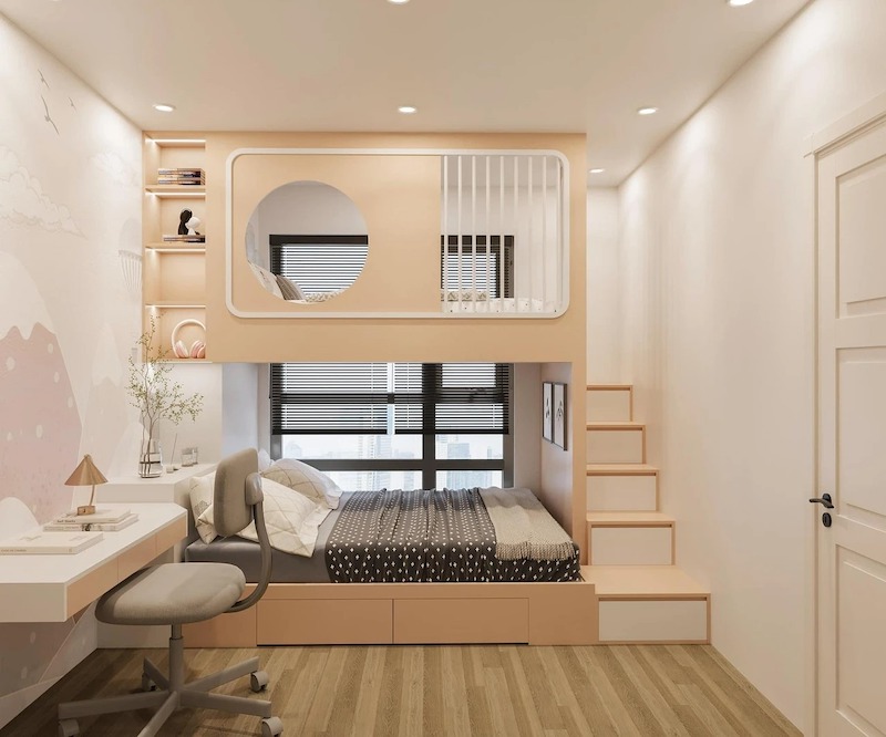 Phòng ngủ cho bé với thiết kế giường tầng thông minh màu cam nhạt, tích hợp cầu thang ngăn kéo, bàn học nhỏ gọn và vách tường trang trí sinh động