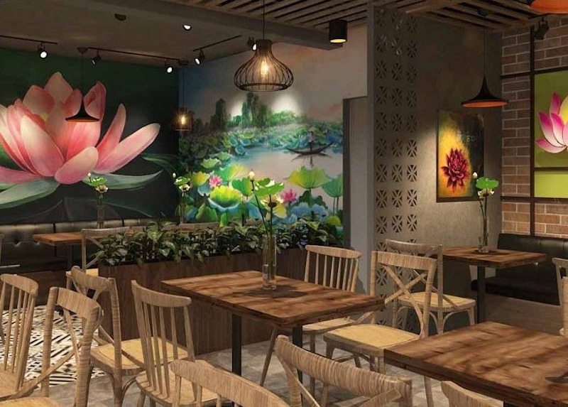 Những bức tranh thiền, tranh thư pháp hoặc điểm nhấn đá tự nhiên giúp nhà hàng chay nhỏ mang đậm chất tinh thần nhẹ nhàng 