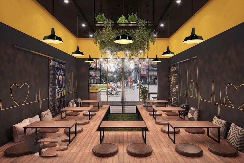 Bàn ghế kim loại, gỗ thô kết hợp ánh sáng vàng giúp không gian công nghiệp trở nên ấm áp và dễ chịu hơn