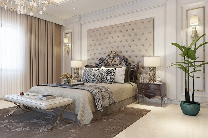 Phòng ngủ được thiết kế với gam màu trung tính, đầu giường bọc nệm và ánh sáng dịu, mang lại cảm giác thư giãn sâu và sự riêng tư cần thiết cho không gian nghỉ ngơi