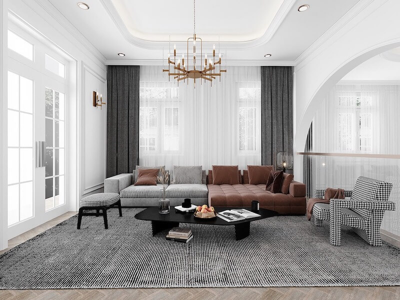 Gam màu trung tính kết hợp điểm nhấn nâu trầm, sofa lớn và đèn chùm tinh tế, tạo cảm giác sang trọng, ấm cúng và cân bằng thị giác