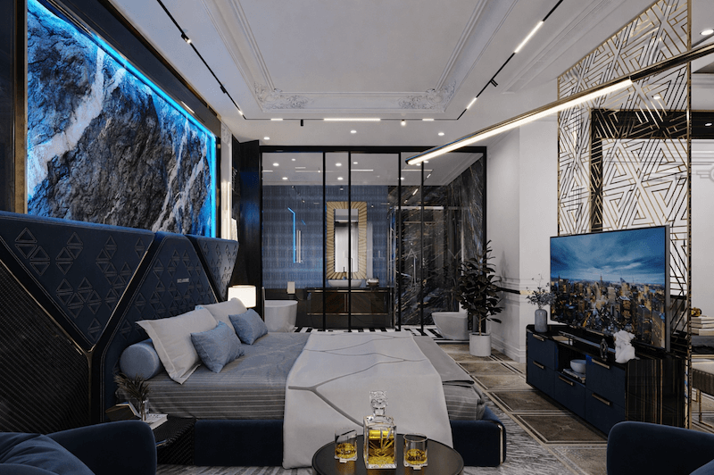 Tông xanh đậm - xám chủ đạo, mảng ốp đá lớn kết hợp ánh sáng gián tiếp và chi tiết kim loại, tạo cảm giác thư giãn và tách biệt khỏi nhịp sống bên ngoài