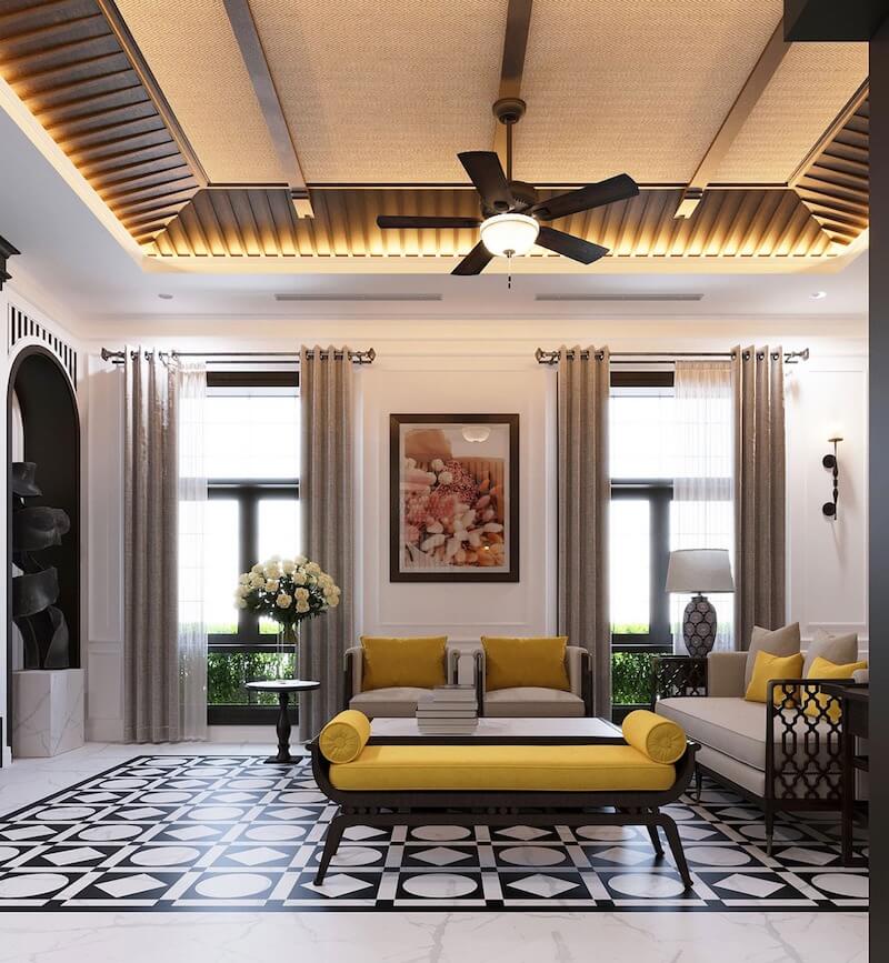 Không gian nổi bật với nền gạch bông họa tiết đen trắng truyền thống, trần nhà ốp gỗ kết hợp lưới mây tre đan ô vuông và quạt trần cổ điển, phong cách Indochine trở nên đặc biệt hơn hết