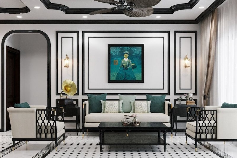 Không gian phòng khách kết hợp tinh thần Á Đông và nét tân cổ điển, đường phào chỉ đen trắng sắc nét, nội thất thanh lịch điểm xanh ngọc, tạo cảm giác sang trọng, hài hòa