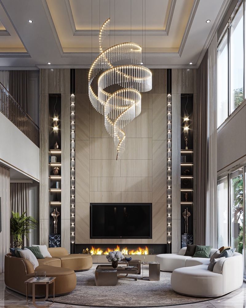 Trần cao giật cấp kết hợp đèn chùm nghệ thuật uốn lượn, mảng tường ốp đá cân đối, tạo cảm giác sang trọng hiện đại nhưng vẫn giữ tinh thần cổ điển