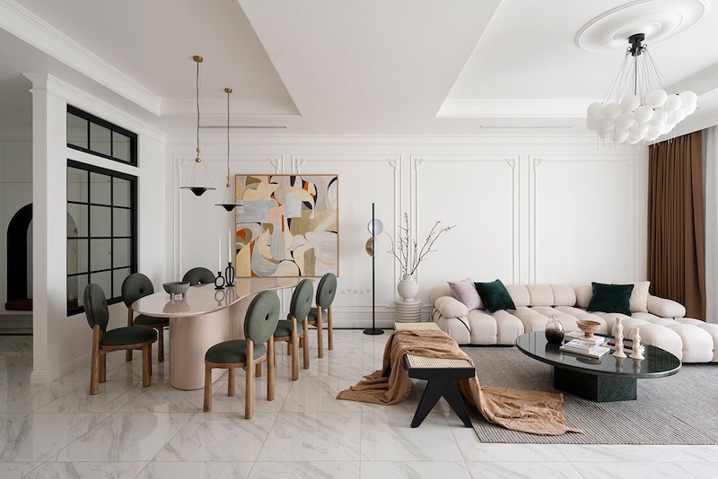 Không gian sinh hoạt sang trọng với hệ phào chỉ tinh giản, tông màu trung tính thanh lịch, nội thất bo cong mềm mại, ánh sáng cân bằng giữa cổ điển và hiện đại