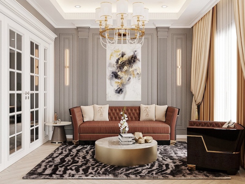 Vật liệu nội thất phòng khách tân cổ điển ưu tiên đá tự nhiên, gỗ quý, vải nhung hoặc da thật, kết hợp chi tiết dát vàng để tạo vẻ sang trọng, bền vững