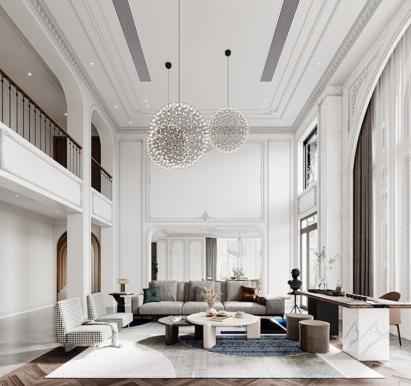 Không gian thông tầng ấn tượng với phào chỉ tinh tế, vòm kiến trúc cao và đèn thả nghệ thuật, tạo cảm giác sang trọng nhẹ nhàng, giàu chiều sâu