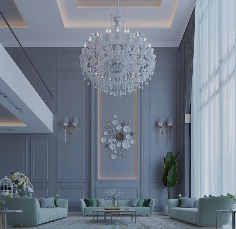 Không gian gây ấn tượng với trần cao, đèn chùm pha lê mềm mại và bảng màu xám xanh tinh tế, tạo cảm giác sang trọng nhưng thanh thoát
