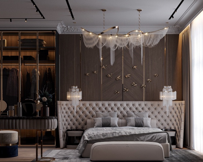 Sự hòa quyện giữa giường bọc nút sang trọng, đèn trang trí nghệ thuật và mảng tường ốp gỗ điểm nhấn, tạo cảm giác ấm áp, tinh tế và đẳng cấp