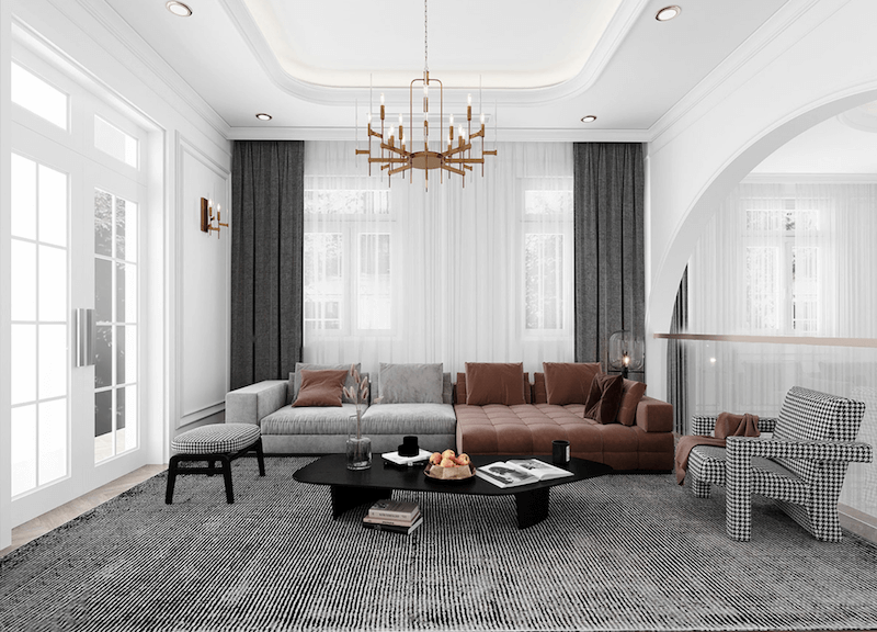 Sofa phối hai gam xám – nâu da cùng bàn trà tối giản, thảm dệt trung tính và ánh sáng tự nhiên tạo nên phòng khách hiện đại, tinh tế, ấm cúng